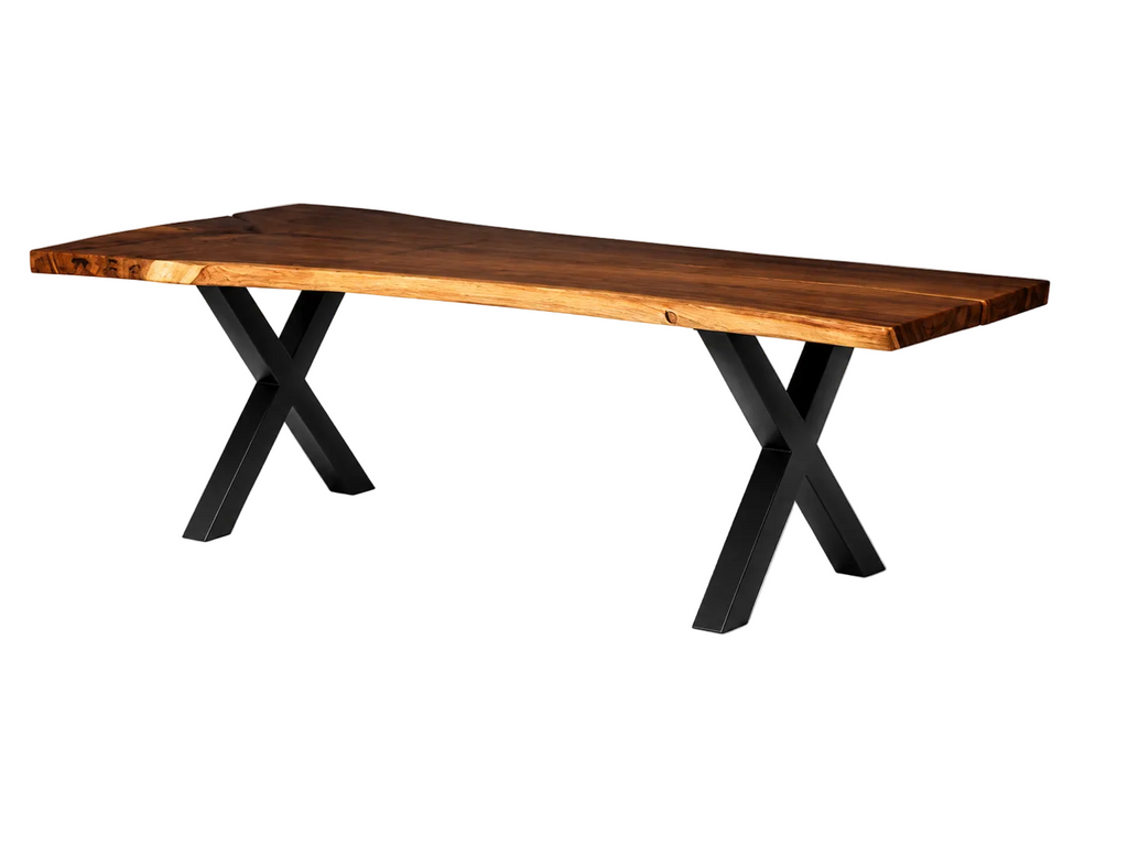 A live-edge wooden dining table with a warm medium-brown wood top and black metal X-shaped legs, shown on a clean white background.